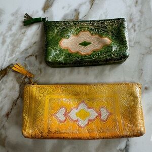 2 Italian leather zipper pouches w/gold accents
